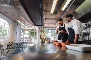 Professional chefs working at restaurant kitchen