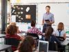 Teacher with tablet in front of elementary school class